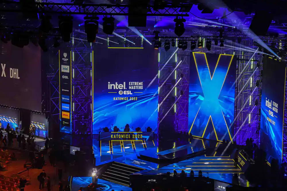 Players competing on the main stage while spectators watch